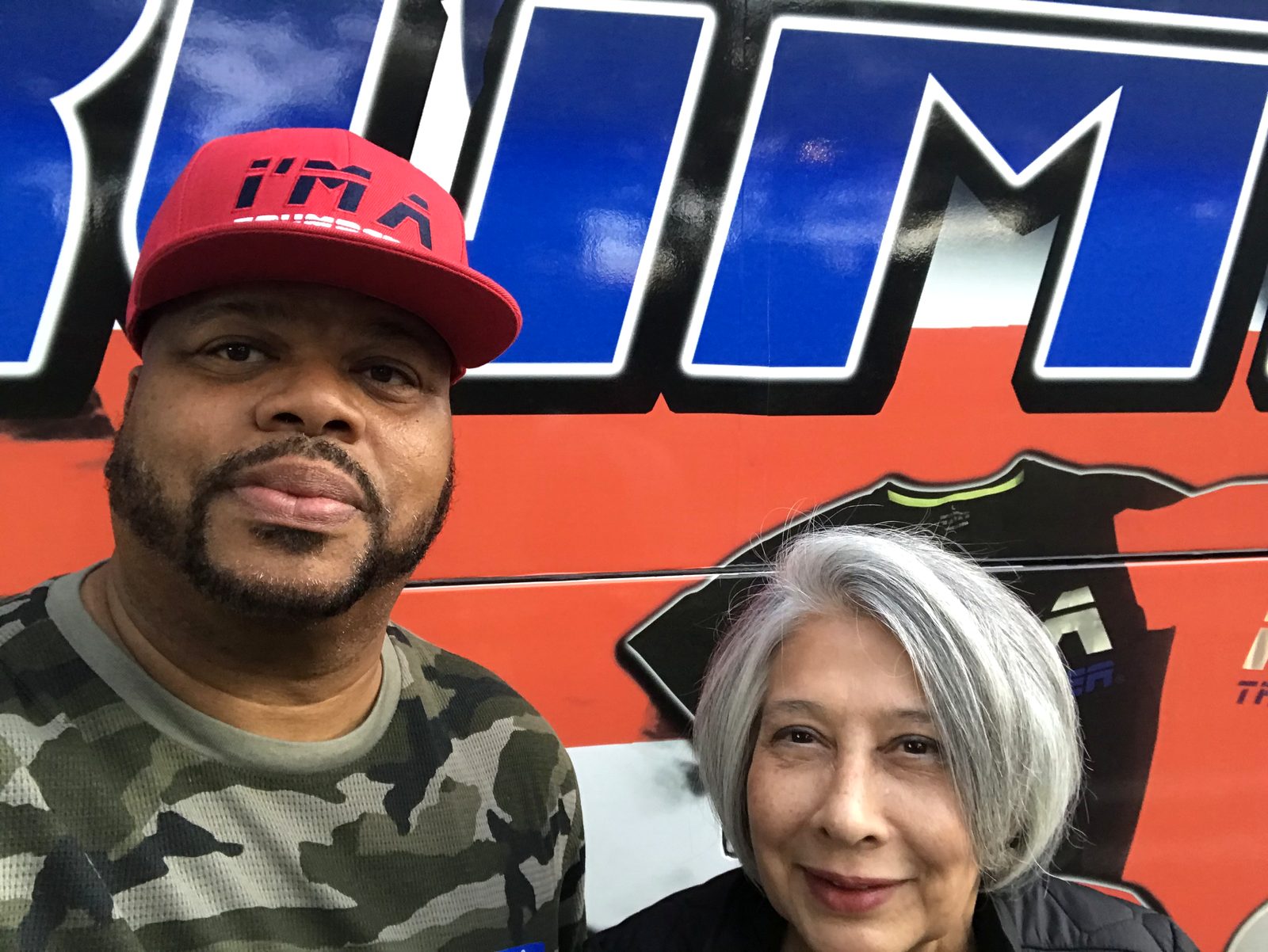 Sydnnia Wulff with a fellow volunteer at a campaign bus stop